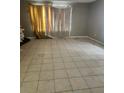 Living room features large-format tile flooring and good natural light at 32 Spring Loop Circle, Ocala, FL 34472