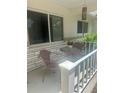Cozy porch features a charming seating area with a small round table, perfect for enjoying the outdoors at 9530 Sw 85Th Ave # B, Ocala, FL 34481