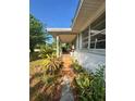 Covered front porch with brick accents, offering a cozy outdoor space at 2323 Sw 3Rd St, Ocala, FL 34471