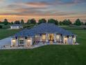 Stunning exterior view of home featuring professional landscaping and a paved walkway to the entrance at 7161 Ne 22Nd Court Rd, Ocala, FL 34479