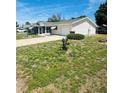 A cozy single-story home boasting a screened porch and well-manicured lawn at 8683 Sw 62Nd Ct, Ocala, FL 34476