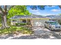 Charming single-story home with a well-manicured lawn, mature trees and an attached two-car garage at 8851 Sw 97Th St # A, Ocala, FL 34481
