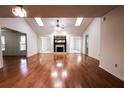 Spacious living room features hardwood floors, fireplace, and skylights for natural light at 1951 Se 37Th Court Cir, Ocala, FL 34471