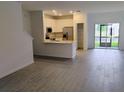 Modern kitchen featuring stainless steel appliances, white cabinetry, and quartz countertops at 3571 Se 37Th Ct, Ocala, FL 34480