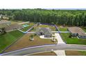 Aerial shot of the property, highlighting its spacious lot, the house exterior, and its proximity to neighboring homes at 6292 Se 13Th St, Ocala, FL 34472