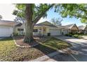 Well maintained single-story home features an attached two-car garage, cozy front porch, and a lush front lawn at 9069 Sw 96Th Ln # B, Ocala, FL 34481