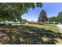 Expansive front lawn offering a picturesque view of the home and the surrounding neighborhood at 9541 Sw 93Rd Loop, Ocala, FL 34481