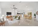 Open-concept living space with modern furnishings, a dining area, and a view of the kitchen at 12 Bahia Pass Ter, Ocala, FL 34472