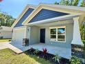 Beautiful single-Gathering home with a two-car garage, a walkway and a small garden at 13518 Sw 114Th Ln, Dunnellon, FL 34432