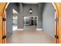 Grand entryway showcasing high ceilings, gray textured walls and unique light fixture with a view of the pool at 1718 Sw 27Th St, Ocala, FL 34471