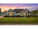 Charming single-story home featuring a well-manicured lawn and inviting front porch at 4020 Se 23Rd St, Ocala, FL 34471