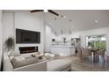 Inviting living space with fireplace and modern kitchen featuring a large island at 5 Willow Trl, Ocala, FL 34472