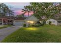 Charming home with well-maintained lawn during sunset at 8833 Sw 98Th Street Rd # E, Ocala, FL 34481