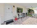 Inviting porch with brick-paved flooring and outdoor seating at 8833 Sw 98Th Street Rd # E, Ocala, FL 34481