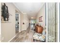 Inviting entryway featuring tile floors, decorative furnishings, and an open floor plan at 8878 Sw 103Rd Cir, Ocala, FL 34481