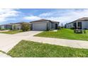 Charming single-story home featuring a well-manicured lawn and an attached two-car garage at 9388 Sw 53Rd Pl, Ocala, FL 34481