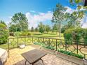 Enjoy outdoor relaxation on the brick-paved patio with views of the landscaped backyard at 9740 Sw 68Th Ln, Ocala, FL 34481