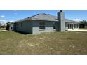 A cozy single story home featuring a chimney and sliding glass doors for outdoor enjoyment at 9934 Se 64Th Ave, Belleview, FL 34420