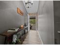 Charming foyer with stylish decor and a view of the front porch at 11311 Ne 40Th Street Rd, Silver Springs, FL 34488