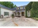 Inviting entrance with a stone path, covered porch, and lush greenery at 1251 Sw 43Rd Pl, Ocala, FL 34471