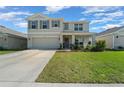 Inviting two-story home with a spacious driveway and beautifully landscaped front yard at 4806 Sw 86Th Ln, Ocala, FL 34476