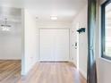 Bright foyer with wood floors, a closet, and neutral paint at 7787 Nw 56Th Pl, Ocala, FL 34482