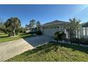 Exterior view of a home showing the driveway and a two car garage at 1961 Sw 170Th Loop, Ocala, FL 34473
