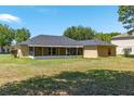 Spacious backyard featuring a screened lanai perfect for outdoor relaxation at 3011 Se 46Th Ave, Ocala, FL 34480