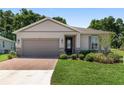 Charming single-story home featuring a two-car garage, landscaped yard and beautiful brick driveway at 4306 Nw 54Th Ter, Ocala, FL 34482