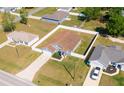 Beautiful single-Gathering home with a white fence, green lawn and driveway to attached garage at 8004 Juniper Rd, Ocala, FL 34480