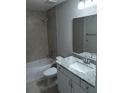Beautifully updated bathroom with tiled shower, granite countertops, and modern vanity at 8661 Juniper Rd, Ocala, FL 34480