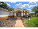 Inviting walkway leading to the front door of this well-maintained home at 10337 Sw 74Th Ter, Ocala, FL 34476