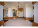 Covered front porch with tile flooring provides a welcoming entrance at 10337 Sw 74Th Ter, Ocala, FL 34476