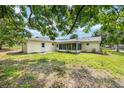 Spacious backyard featuring a screened patio and green lawn, great for outdoor relaxation at 11153 Sw 79Th Ave, Ocala, FL 34476