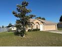 A charming one-story home with a well-maintained lawn and a covered parking area at 13785 Sw 42Nd Court Rd, Ocala, FL 34473