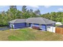 Aerial view of the home showing its architectural details and surrounding landscape at 13800 Sw 33Rd Court Rd, Ocala, FL 34473