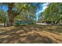Charming home with a spacious yard and an additional screened structure at 14190 Ne 209Th Ct, Fort Mc Coy, FL 32134
