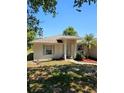 Delightful single-story home featuring a neatly landscaped front yard and an inviting front entrance at 1441 Admiral Nimitz Ave, Daytona Beach, FL 32124