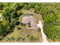 Expansive backyard with a screened-in pool and patio area at 21939 Sw 85Th Loop, Dunnellon, FL 34431