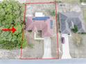 An aerial view showing a home with solar panels on the roof, with property lines and neighboring houses outlined at 2730 Sw 162Nd Street Rd, Ocala, FL 34473