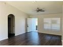 Spacious living room with vaulted ceilings, wood floors, and a welcoming entryway at 38 Laurel Ct, Ocala, FL 34480