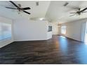 Spacious living room featuring vaulted ceilings, hardwood floors, and an open layout at 38 Laurel Ct, Ocala, FL 34480