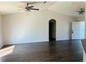 Open living room featuring vaulted ceilings, hardwood floors, and a bright, airy atmosphere at 38 Laurel Ct, Ocala, FL 34480