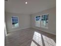 Bright bedroom with large windows and tile floors, offering ample natural light at 8344 Sw 57Th Ct, Ocala, FL 34476