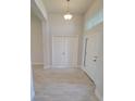 Bright foyer featuring neutral paint, stylish tile flooring, and a view of the home's interior at 8483 Sw 59Th Ter, Ocala, FL 34476