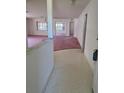 Open-concept living space with neutral walls, and transition to the other rooms at 9012 Sw 91St Cir, Ocala, FL 34481