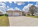 Charming single-story home with two-car garage, well-maintained lawn, and mature landscaping at 2369 Nw 53Rd Avenue Road, Ocala, FL 34482