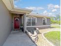 Close up of home's front door, landscaping, and walkway up to the home at 2689 Sw 165Th Street Rd, Ocala, FL 34473