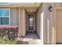 Inviting front entrance with a brick pathway leading to a wood door with glass inserts at 3918 Nw 46Th Ter, Ocala, FL 34482