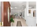 Inviting entryway with tile floors and an oval glass door, leading to a bright living area at 4085 Sw 110Th St, Ocala, FL 34476